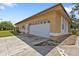Attached garage with ample space and built-in shelving at 791 Haleybury St, Port Charlotte, FL 33948
