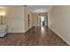 Spacious living room with wood-look floors and large windows at 791 Haleybury St, Port Charlotte, FL 33948
