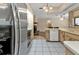 Kitchen with stainless steel appliances and light wood cabinets at 791 Haleybury St, Port Charlotte, FL 33948