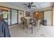 Covered patio with table and chairs, great for outdoor entertaining at 791 Haleybury St, Port Charlotte, FL 33948