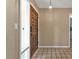 Home entryway, featuring a wood door and tile floor at 791 Haleybury St, Port Charlotte, FL 33948