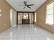 Large bedroom with mirrored wall and ceiling fan at 791 Haleybury St, Port Charlotte, FL 33948