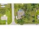 Aerial view of a single-Gathering home with a pool, surrounded by a spacious yard at 791 Haleybury St, Port Charlotte, FL 33948
