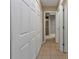 Bright hallway with tile flooring and ample closet space at 791 Haleybury St, Port Charlotte, FL 33948