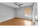 Well-lit bedroom with wood-look floors and a ceiling fan at 791 Haleybury St, Port Charlotte, FL 33948