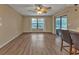 Living room with wood-look floors and sliding doors to patio at 791 Haleybury St, Port Charlotte, FL 33948