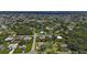 Aerial view showing home's location in a residential neighborhood with surrounding houses and lush greenery at 791 Haleybury St, Port Charlotte, FL 33948