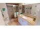 Bathroom with granite vanity, shower, and updated fixtures at 3600 Bal Harbor Blvd # 1-O, Punta Gorda, FL 33950
