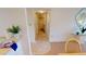 Hallway with tile flooring leading to laundry and bedrooms at 3600 Bal Harbor Blvd # 1-O, Punta Gorda, FL 33950