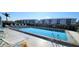Inviting community pool with lounge chairs and tables at 3600 Bal Harbor Blvd # 1-O, Punta Gorda, FL 33950