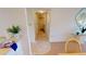 Bright hallway with tile flooring, leading to laundry and other rooms at 3600 Bal Harbor Blvd # 1-O, Punta Gorda, FL 33950