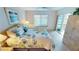 King-size bedroom with water views and sliding door access at 3600 Bal Harbor Blvd # 1-O, Punta Gorda, FL 33950