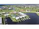 Aerial view of condo building near the water with tennis courts and pool at 3600 Bal Harbor Blvd # 1-O, Punta Gorda, FL 33950