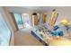 King bedroom with patio access and ample closet space at 3600 Bal Harbor Blvd # 1-O, Punta Gorda, FL 33950
