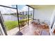 Relaxing screened patio overlooking the canal with seating for two at 3600 Bal Harbor Blvd # 1-O, Punta Gorda, FL 33950