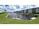 Community dock with boats and lush green landscaping at 3600 Bal Harbor Blvd # 1-O, Punta Gorda, FL 33950