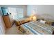 Bedroom with two beds, dresser, and window coverings at 3600 Bal Harbor Blvd # 1-O, Punta Gorda, FL 33950