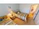 Guest bedroom with full-size bed and adjacent bathroom at 3600 Bal Harbor Blvd # 1-O, Punta Gorda, FL 33950