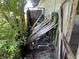 Outside area with damaged wooden structures and plumbing equipment at 31840 Washington Loop Rd, Punta Gorda, FL 33982