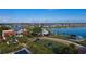 Aerial view of community with lakefront and solar-powered buildings at 15836 Appalachian Dr, Punta Gorda, FL 33982