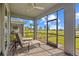 Spacious screened-in porch with patio furniture and a view at 15836 Appalachian Dr, Punta Gorda, FL 33982