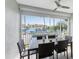 Enjoy waterfront views from this lanai, complete with a dining table for outdoor meals at 3311 Wood Thrush Dr # 113, Punta Gorda, FL 33950