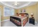 Spacious bedroom with a king-size bed and ceiling fan at 3311 Wood Thrush Dr # 113, Punta Gorda, FL 33950