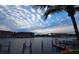 Calm waters, boat docks, and resort-style buildings at sunset at 3311 Wood Thrush Dr # 113, Punta Gorda, FL 33950