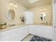 Spa-like bathroom with double sinks, corner cabinet, and a walk-in shower at 3311 Wood Thrush Dr # 113, Punta Gorda, FL 33950