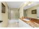 Bathroom with marble vanity, a tub, and a shower at 3311 Wood Thrush Dr # 113, Punta Gorda, FL 33950