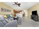 Spacious living room features a large TV, comfortable seating, and an open layout at 3311 Wood Thrush Dr # 113, Punta Gorda, FL 33950
