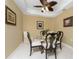 Charming dining room with glass-top table and four elegant chairs at 3311 Wood Thrush Dr # 113, Punta Gorda, FL 33950