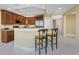 Kitchen with granite countertops, stainless steel appliances, and a breakfast bar at 3311 Wood Thrush Dr # 113, Punta Gorda, FL 33950