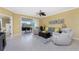 Living area with sliding doors leading to a balcony and comfortable seating arrangement at 3311 Wood Thrush Dr # 113, Punta Gorda, FL 33950