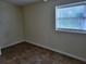 Small bedroom with tile floor and window at 21440 Holdern Ave, Port Charlotte, FL 33952