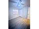 Bedroom with wood-look floors and ceiling fan at 6828 Ketona Rd, North Port, FL 34287