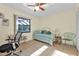 Bedroom with daybed, office space, and pool view at 25499 Taltal Dr, Punta Gorda, FL 33983