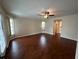 Main bedroom with wood flooring and ceiling fan at 23077 Madelyn Ave, Port Charlotte, FL 33954