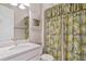 Clean bathroom with shower/tub combo and updated vanity at 1596 Hyssop Loop, North Port, FL 34289
