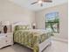 Spacious bedroom with a king-size bed and tropical bedding at 1596 Hyssop Loop, North Port, FL 34289