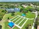Community bocce ball courts with shaded seating areas at 1596 Hyssop Loop, North Port, FL 34289