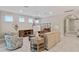 Bright and airy living room with comfortable seating and a neutral color palette at 1596 Hyssop Loop, North Port, FL 34289