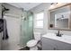 Modern bathroom features a tiled shower with glass door and stylish vanity at 3159 Draper Ter, North Port, FL 34286