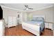 A well-furnished bedroom with hardwood floors and access to the bathroom at 3159 Draper Ter, North Port, FL 34286