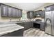 Well-equipped kitchen with modern appliances, granite countertops, and ample cabinet space at 3159 Draper Ter, North Port, FL 34286