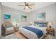 Cozy bedroom with natural light, complemented by beach-themed decor at 3159 Draper Ter, North Port, FL 34286