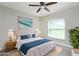 Comfortable bedroom featuring a large window and simple, stylish decor at 3159 Draper Ter, North Port, FL 34286