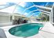 Inviting backyard pool area surrounded by screened enclosure at 3159 Draper Ter, North Port, FL 34286