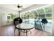 Enclosed patio area with ample seating and a pristine in-ground pool at 3159 Draper Ter, North Port, FL 34286
