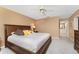 Bedroom with king-size bed and access to a full bathroom at 1250 W Marion Ave # 242, Punta Gorda, FL 33950